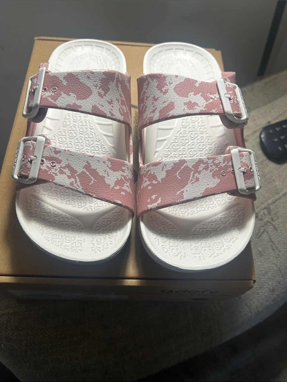 Gravity Defyer Therapeutic pink and white sandals.